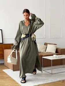 Full length view of a French style olive green linen maxi dress with side slit