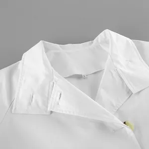 Close-up view showing the white trench coat collar design and fabric texture detail