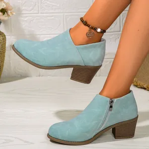Elegant light blue chunky heel ankle boots for women, detailed view of style and fit