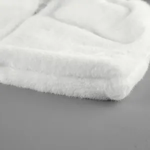 Close-up of soft white faux mink fur vest texture showing high-quality plush material detail.