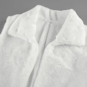 Detailed macro view of soft white faux mink fur vest with a high-quality zipper.