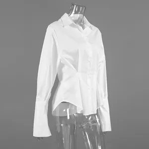 Elegant white pure cotton pleated waist shirt with long cuffs shown from a side angle