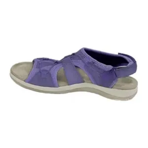 Detailed side profile of purple wedge sandals featuring adjustable velcro strap closure