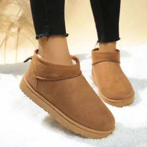 Detailed view of fashionable brown suede snow boots with warm fleece lining for the winter