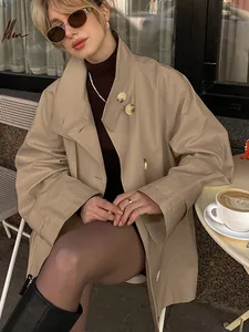Elegant oversized khaki mid-length trench coat for women with stylish lapel design and buttons