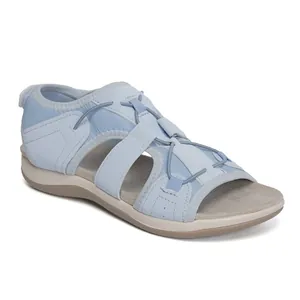 Close-up of light blue breathable casual women's flat sandals for summer beach wear.