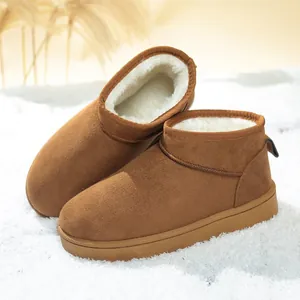 Close-up of brown women's snow boots with thick white fleece lining for winter warmth
