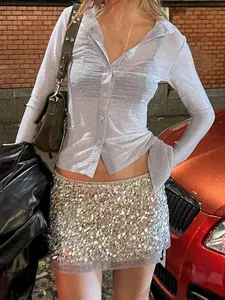Shimmering light blue long-sleeve shirt with waist tie and reflective fabric detail