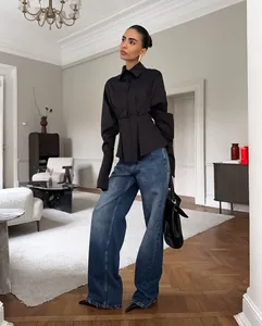 High-end black long-sleeve shirt with pleated waist and elegant lapel collar design