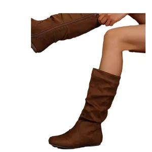 Brown suede mid-calf slouchy boots featuring a side zipper and comfortable flat sole