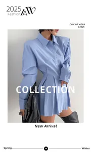 Close-up detail of light blue long-sleeved cotton shirt with structured pleated waist