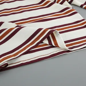 Detail view of the stitching and texture of a vintage striped knit T-shirt