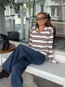 Retro striped polo knit sweater with long sleeves in a chic street style look