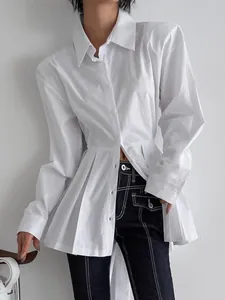 Elegant white long-sleeve cotton shirt with a stylish pleated waist design for women.