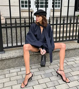 Stylish model wearing blue soft denim two-piece set with bubble sleeve top and shorts