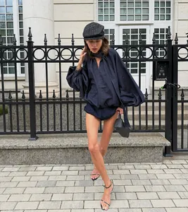 Fashion street view of a navy blue cotton set with puff sleeve blouse and shorts