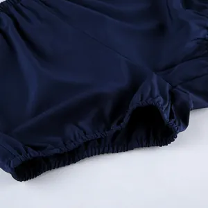 Close-up detail showing the elastic leg opening of dark blue soft denim shorts for women