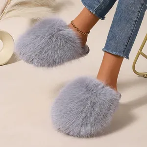 Cozy grey fluffy faux fur slippers for women, stylish winter flat home slides for comfort.