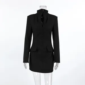 Front view of a sleek black long-sleeve blazer dress with stand collar and buttons