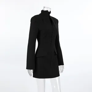 Angled profile of a black long-sleeve slim-fit blazer dress with elegant button details.