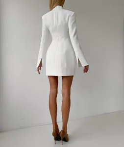 Rear view of an elegant white slim-fit blazer dress with split sleeves and stand collar
