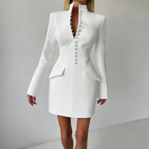 Detailed close-up of a white slim-fit blazer dress with high neck and button accents