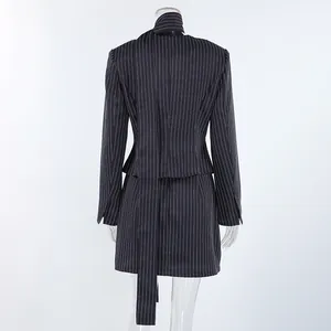 Detailed back view of a chic pinstriped halter blazer and matching skirt set in navy