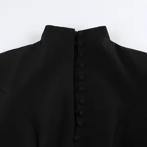Close-up of the back of a professional black high-collar blazer dress with elegant buttons