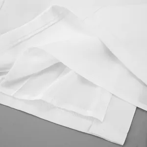 Detailed close-up view of the white A-line skirt showing inner lining and hem stitches