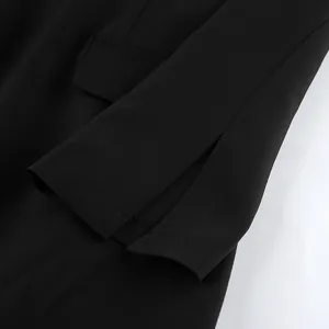 Detailed close-up showing the elegant slit cuff design of the black tailored blazer dress