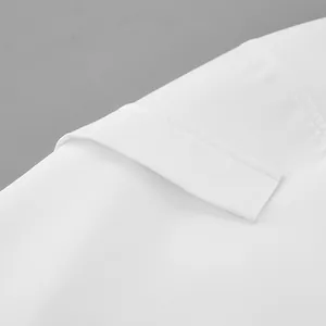 Close-up of clean stitching and fabric texture on a white high-waist A-line skirt