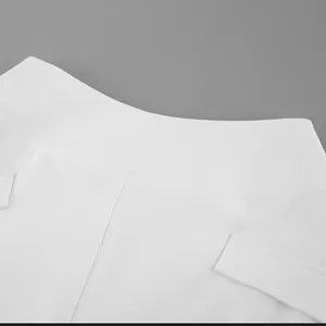 Macro close-up view of the high waist and fabric texture of a white A-line skirt