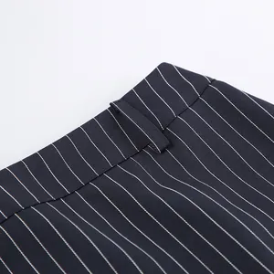 Detailed view of navy blue pinstriped fabric and waistline belt loop for a formal blazer