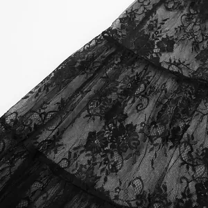 Macro view showing the intricate floral lace and mesh texture of this black skirt.