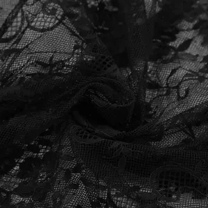 Detailed close-up showing the intricate floral pattern of high-quality black lace fabric