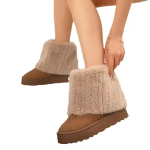 Stylish women's platform snow boots with thick plush faux fur trim in brown suede finish