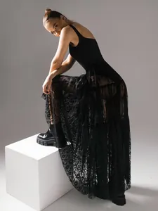 Sexy black sheer floral lace high-waisted maxi skirt for professional studio fashion display.