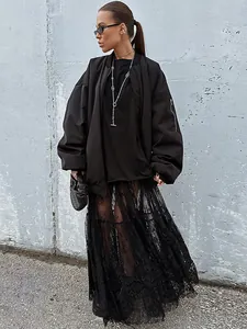 High-waisted black transparent lace long skirt for women styled with a black jacket