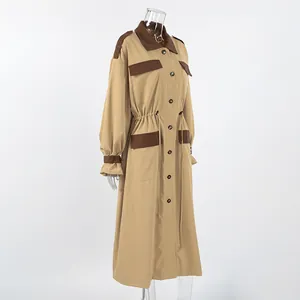 Full-length side view of a khaki oversized trench coat with brown contrast trim.