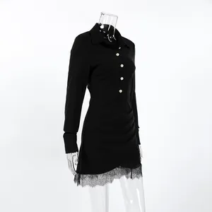Detail view of black slim-fit shirt dress with lace hem and ruched waist detail