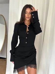 Close-up of black slim fit shirt dress with lace patchwork and pearl cuff details