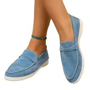 Elegant women's blue suede flat loafers featuring a comfortable slip-on design for casual wear