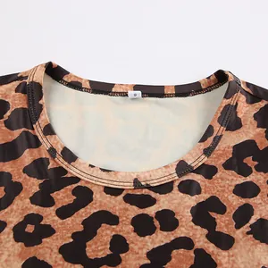 Close-up of the round neckline on a leopard print knit bodysuit with size tag