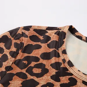 Close-up detail of the crew neck and leopard print fabric on a slim-fit knit bodysuit
