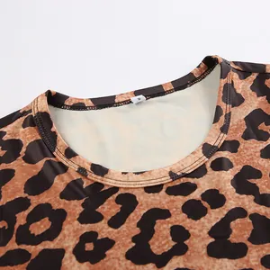 Close-up detail of the round neckline and stitching on a leopard print knitted bodysuit