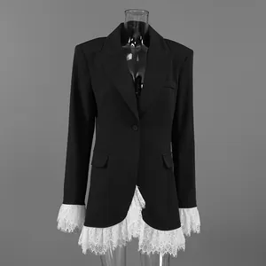 Detailed view of a black blazer jacket featuring elegant white lace trim on cuffs and hem.