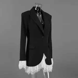 Detail view of a black V-neck blazer featuring elegant white lace trim at the hem and cuffs.