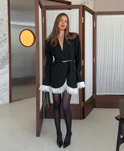 Elegant black blazer for women featuring white lace trim and a deep V-neckline detail