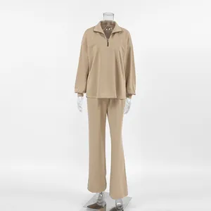 Women's khaki two-piece set featuring half-zip sweatshirt and matching wide-leg trousers.