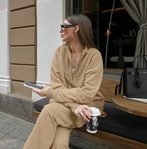 Chic khaki oversized half-zip sweatshirt and matching joggers set in a street style setting